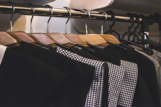 Clothes on hangers in shop. Close up