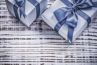 Packed giftboxes on vintage wood board holidays concept