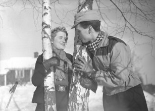 Winter in the 1940s. A young couple is enjoying their winter vacation, and they are wearing the