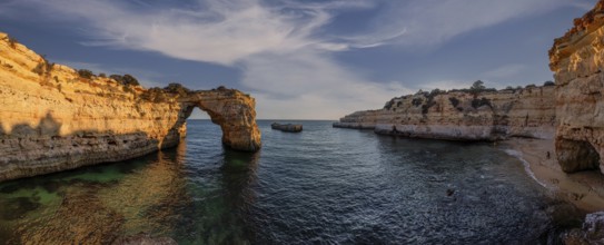 Praia de Estaquinha, Portuguese coast near the city of Lagos in the light of the setting sun