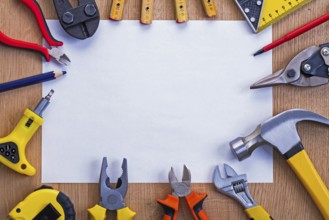 Organized copyspace horizontal version white blank sheet of paper and tools on wooden board