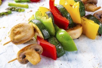 Vegetarian skewers white mushrooms, peppers and zucchini for barbecue