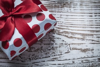 Present box on vintage wooden board celebrations concept