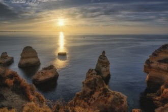 Lagos Praia da Balanca, Portuguese coast near the city of Lagos in the light of the rising sun