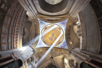 Facilities in the Holy Sepulchre. The magnificent round arch of a ceiling is shined with two bright