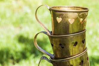 Metal cups with heart shapes