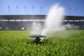 Watering grass on a football stadium in Lubin, Poland, Europe