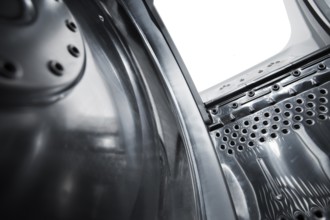 Interior view of a new european top loading washing machine. Very short depth-of-field