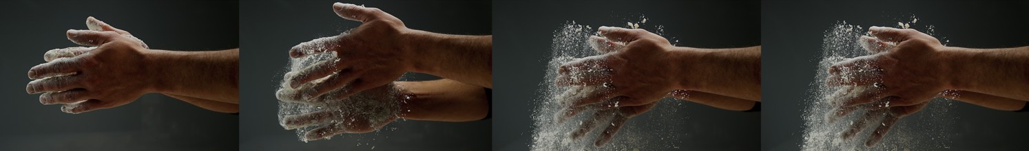 Hands of Man with Flour against black background