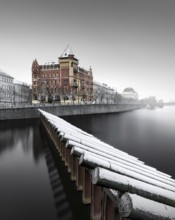 Snow-covered Prague architecture on the Vltava River in Prague, Czech Republic, Europe