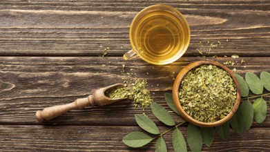 Flat lay green leaves cup tea