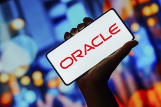 In this photo illustration, the Oracle logo is displayed on a smartphone screen