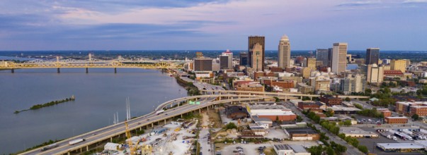 Colorful bridges lead into the buildings and streets of downtown city center Louisville Kentucky