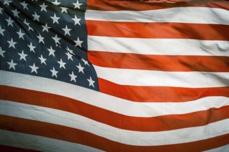 Retro Filtered Photo Of USA Stars And Stripes Flag In The Wind