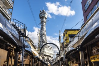 OSAKA, JAPAN - SEPTEMBER 26 2024: The famous Shinsekai area with Tsutenkaku Tower on a clear autumn