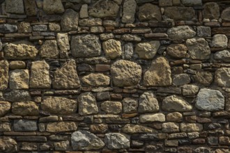 Old medieval stone and brick wall background