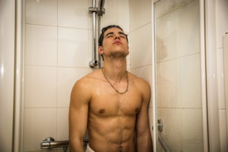 Close up Attractive Young Bare Muscular Young Man Taking Shower, Looking Down