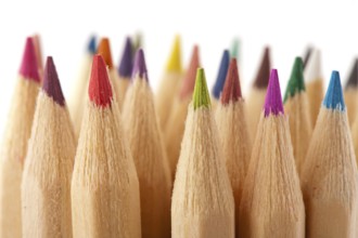 Many wooden color pencils isolated over white