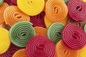 Colorful licorice candy drop rolls as background