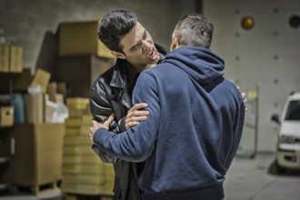 Close up Hungry Young Male Vampire with Scary Facial Expression Bites the Neck While Holding a Man