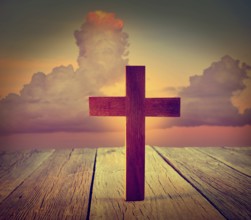 Christian wood cross on sunset sky wooden made
