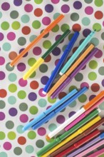 Pens on colorful circles background