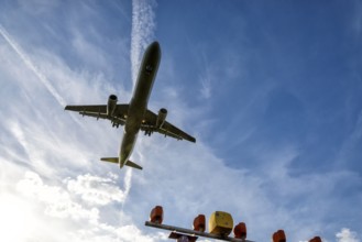 Aircraft on final approach to the airport shortly in front of landing