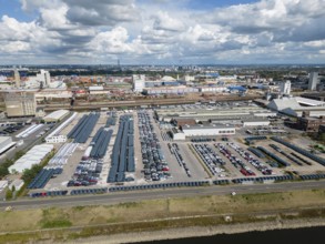 Car terminal in a port on the Rhine. Vehicles are stored, loaded and unloaded, and prepared for