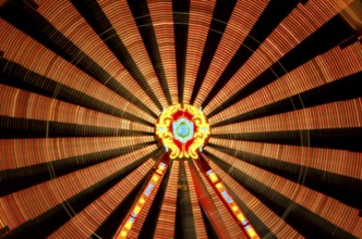 Close Up on an Illuminated Amusement Park Wheel at Night in Long Exposure in SWitzerland