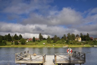 A wooden jetty with a nice view over the Osterdalalven river close to the Swedish village Djuras