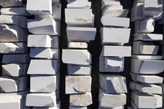 Aerial photographic documentation of a warehouse of white marble blocks ready for shipment