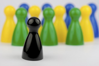 Conceptual game pawns that depict the concept different