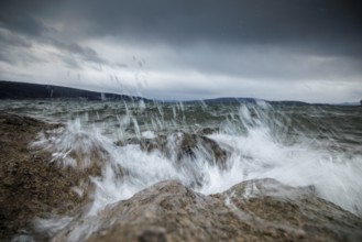 Stormy sea with powerful waves crashing against rocky shore, harbour, Mittelzell, Reichenau, Lake