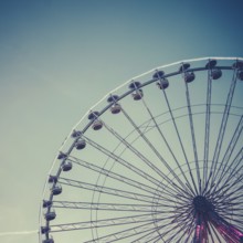 Retro Vintage Style Photo Of A Ferris Wheel At An Amusement Park At Dusk