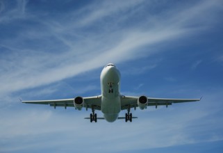 Passenger airplane in the clouds before landing