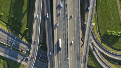 Aerial top view of lot of cars on modern road junction