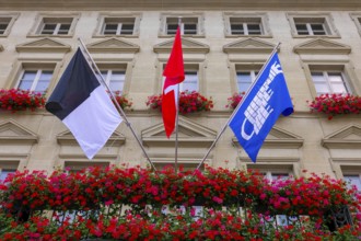 City Hall with Flag and Flowers in a Sunny Summer Day in City of Fribourg, Canton Fribourg,