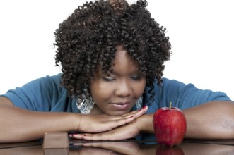 A woman trying to decide whether or not to eat healthy