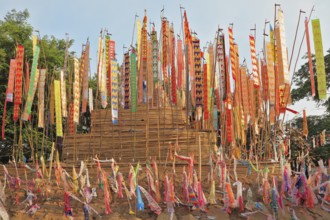 The flags and pennants adorn a special bamboo tower. Thai New Year - Songkran