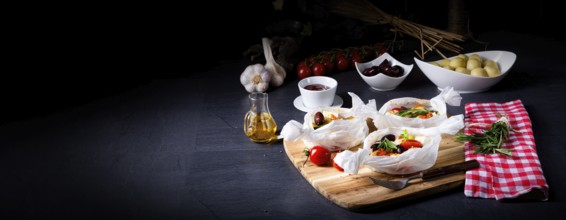 Baked dumplings with courgette, tomatoes and diced sheep's cheese