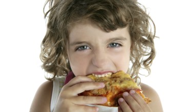 Little girl eating hungry pizza closeup portrait face detail wite background