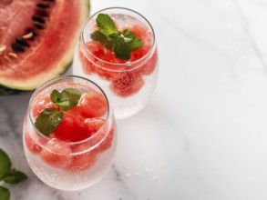 Watermelon ice with sparkling water or soda in glass tumbler. Summer party idea and recipe, add