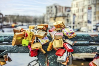 Padlocks tied on a bridge as a symbol of eternal love in an Amsterdam channel