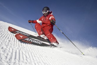 Skiers in action, deep snow, Austria, Europe