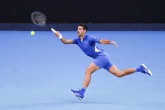 MELBOURNE, AUSTRALIA, JANUARY 11: Novak Djokovic of Serbia plays Stefanos Tsitsipas of Greece