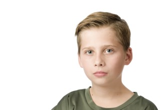 Head-and-shoulders portrait of a young male teenager in a T-shirt looking at the camera against a