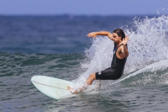 BELLS BEACH, AUSTRALIA, JANUARY 26 2024: Surfers in action at the iconic Bells Beach on a warm