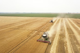 Combine harvester working on a wheat field. Combine harvester Aerial view