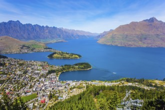 Huge azure lake among the mountains. Bird's eye view. Travel to New Zealand, South Island. The city