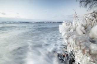 Frozen lake with waves and cloudy sky on a cold winter day, Hörnle, Constance, Lake Constance,